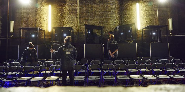 Video design students installing large video projectors in the Tower Bridge Bascule Chamber