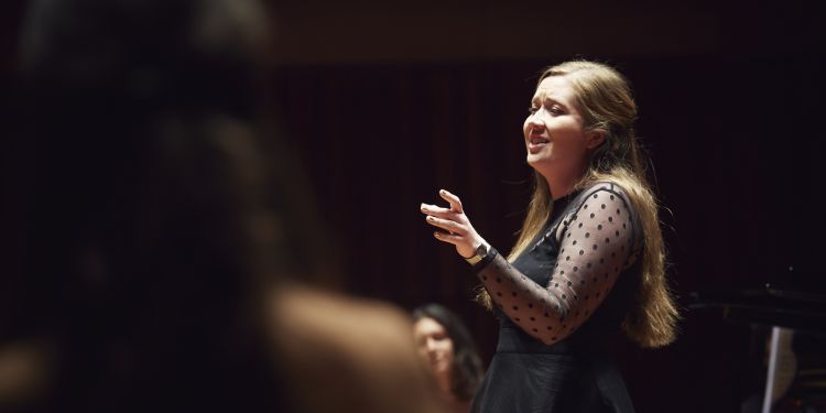 singer performing in songs at six concert