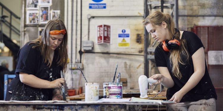 scenic artist painting in the workshop