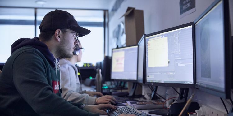 Video design student working at a computer