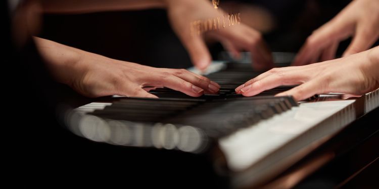 hands on piano keys