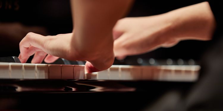hands on piano keys