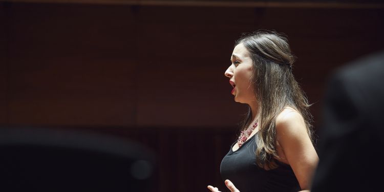 Singer performing on stage in Milton Court
