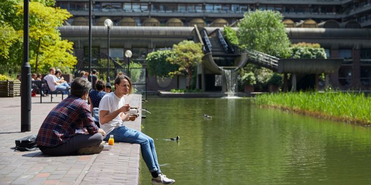 Students sitting on Lakeside Terrace outside Silk Street