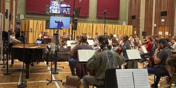 Strings players in the Music Hall, rehearsing in real time over the low latency network