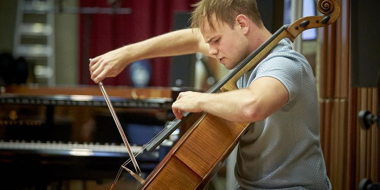 Cellist rehearsing in the Music Hall