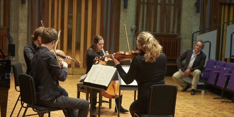 Strings musicians in a masterclass with Takacs Quartet 