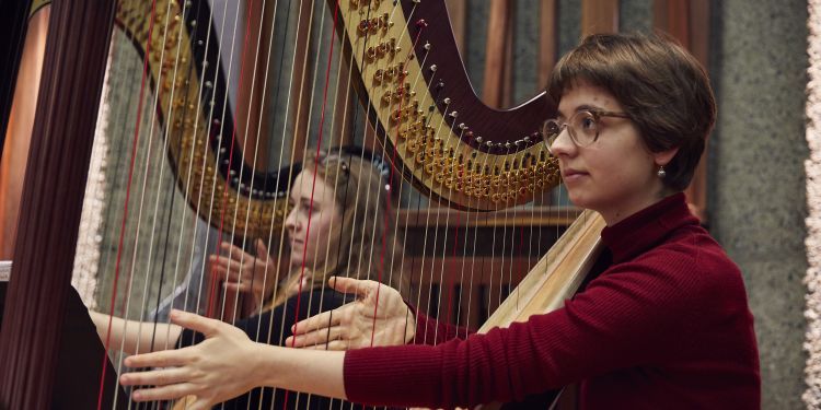Harpists ready to play in an orchestal rehearsal in Silk Street Music Hall