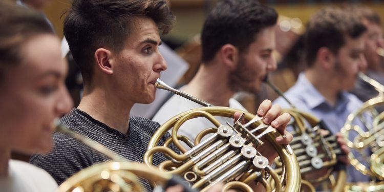 Horn players in an orchestal rehearsal in Silk Street Music Hall