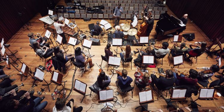 Guildhall Studio Orchestra on stage in Milton Court Concert Hall for a rehearsal