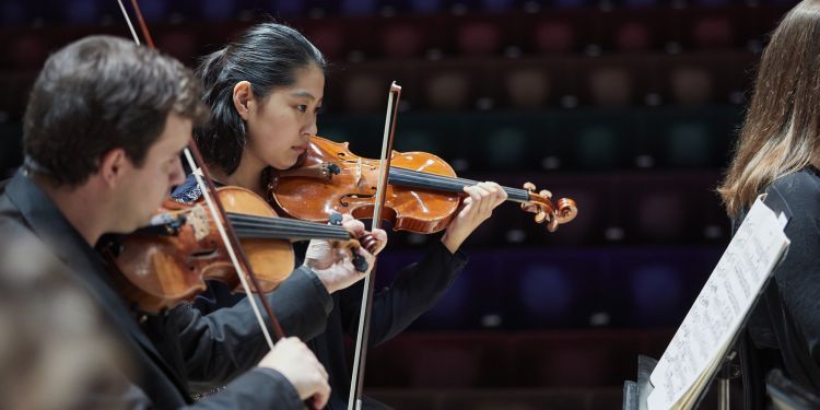 Viola players in an orchestral rehearsal