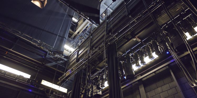 Looking up into the automation and lighting of the Milton Court Theatre
