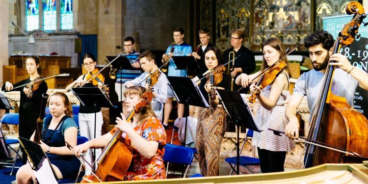 Guildhall baroque strings players perform in a church