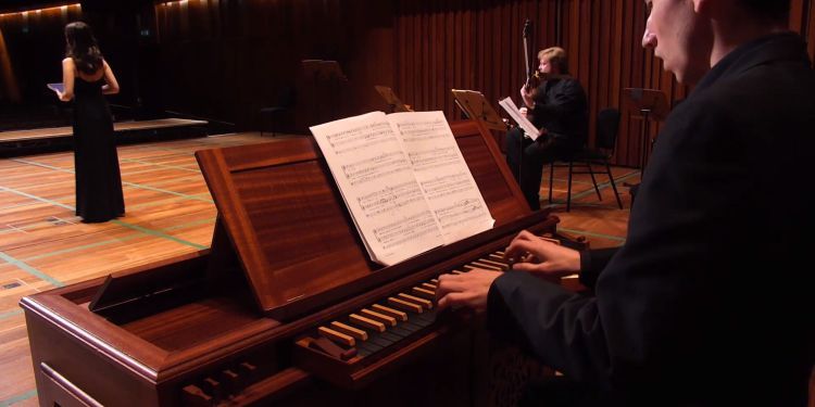 Harpsichord player peforms in Milton Court Concert Hall