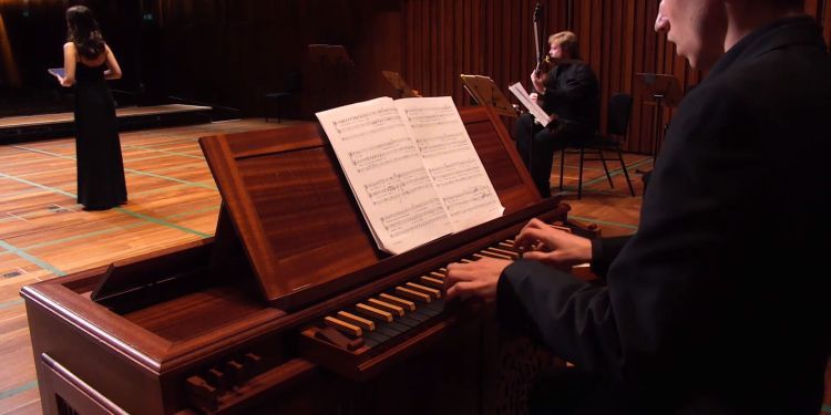 Harpsichord player peforms in Milton Court Concert Hall