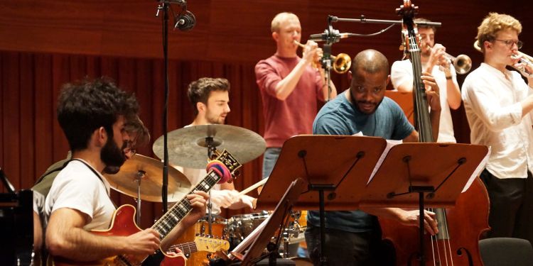 Jazz rhythm section rehearsing in Milton Court