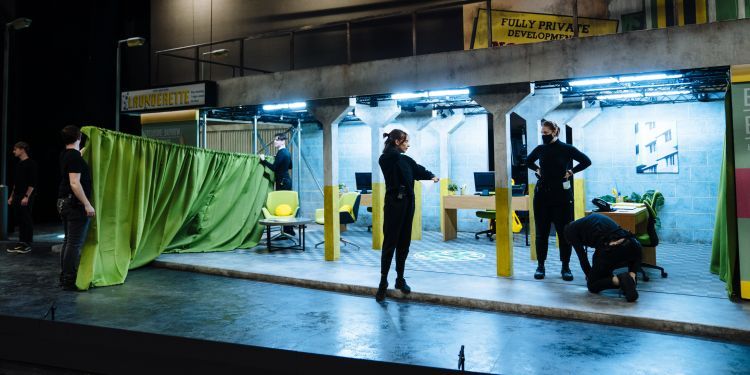 Stage Managers setting out props on stage