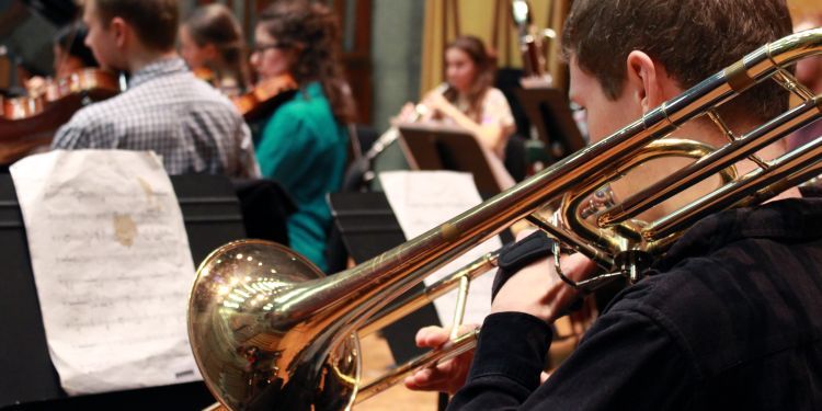 Trombone and wind players during an Ubu Ensemble rehearsal