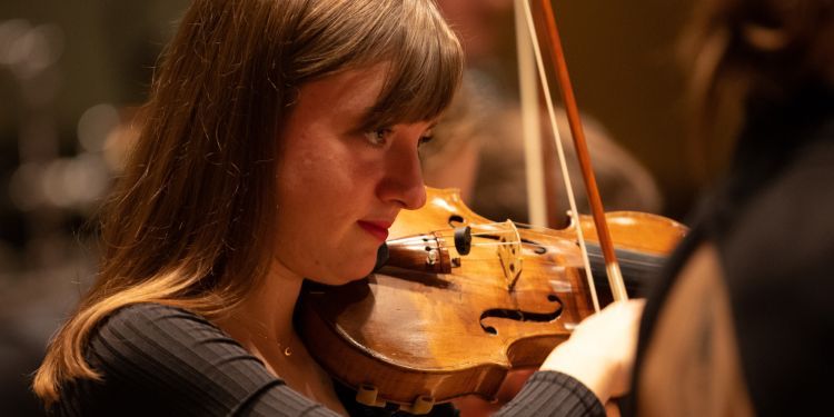 Jazz violin player performing in Silk Street Music Hall