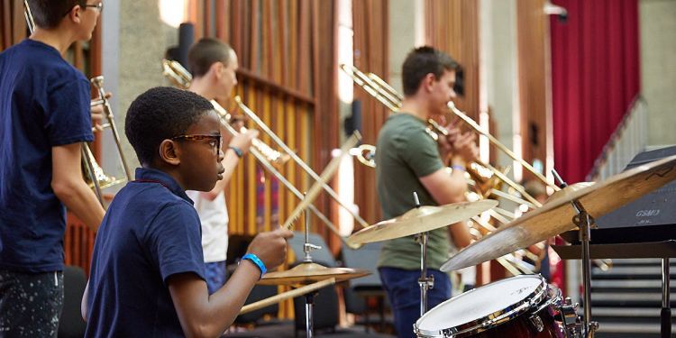 student playing drums