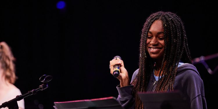 participant holding microphone