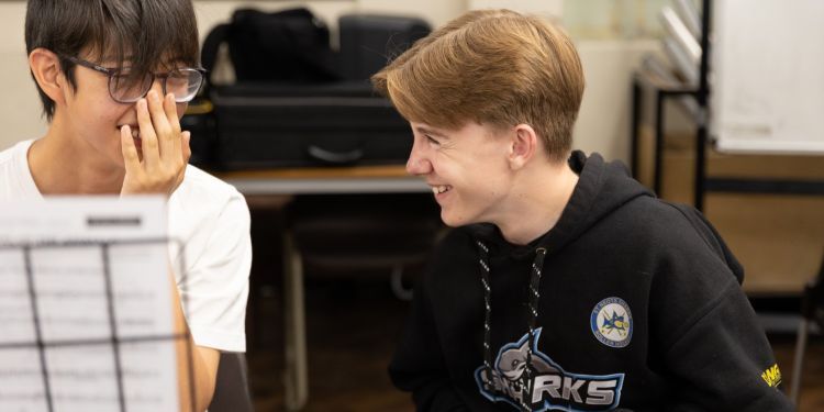 Two boys laughing with each other