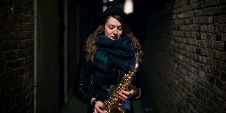 Rachael Cohen holding saxophone