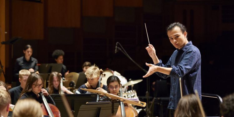 Otis Enokido-Lineham conducting the LSSO at the LSSO & CYM Anniversary Concert (2022). Photo by Kevin Leighton. 