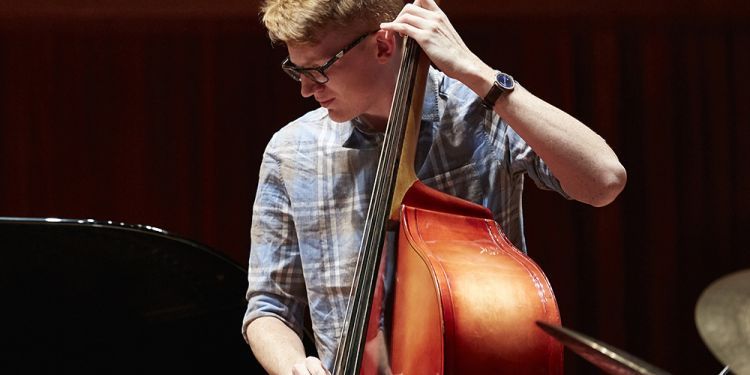 Jazz bass player on Milton Court Concert Hall stage