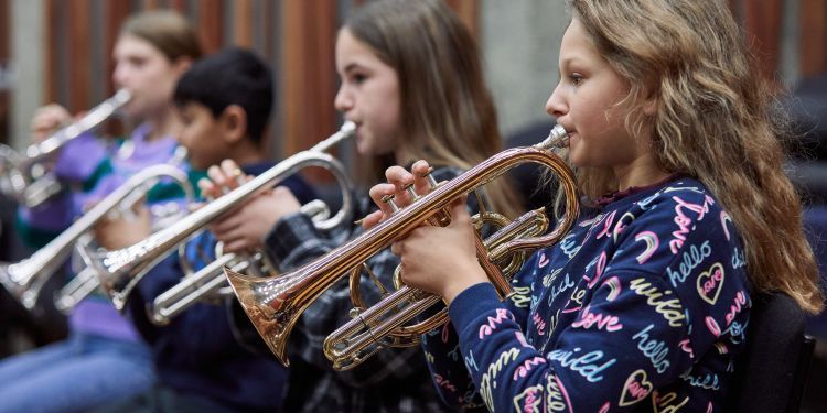 Students playing the trumpet