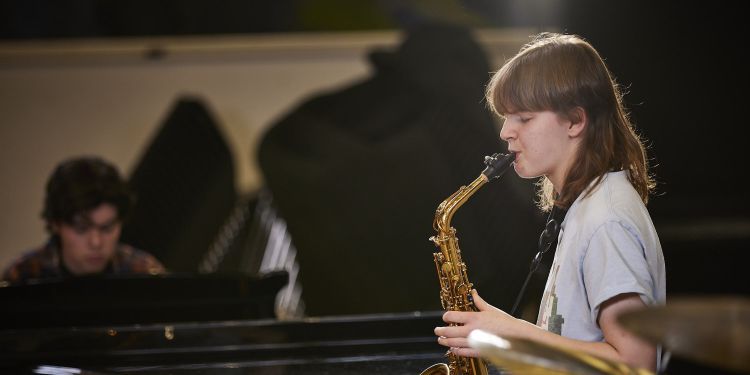 CYM student plays saxophone