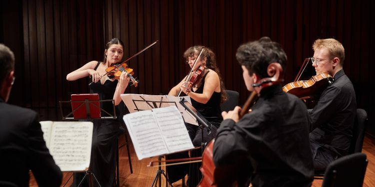 Photo of students on stage performing