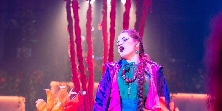 Guildhall opera singer performing on a colourful set