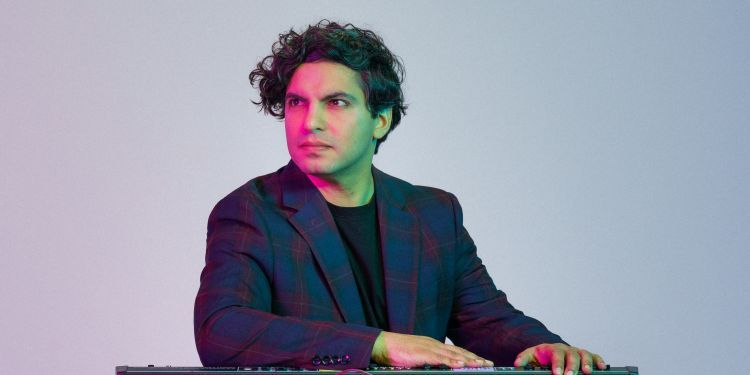 Zubin Kanga posing with a keyboard
