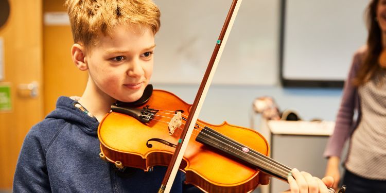 Boy playing a violin