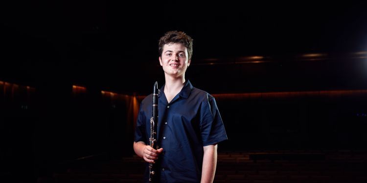 Image of Thomas Young holding a clarinet