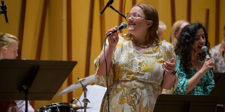 Female singer holding microphone