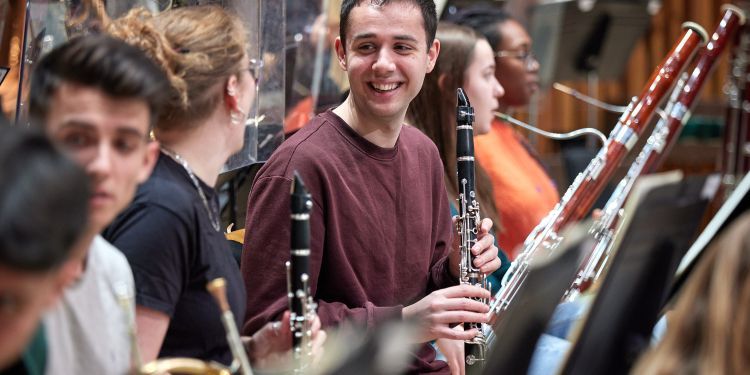 Female and male Guildhall wind students smiling