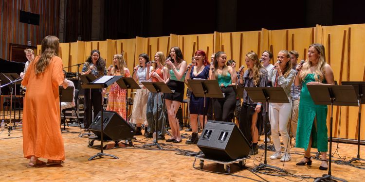 Students singing as part of the summer 2023 performance of the Jazz Ensmble