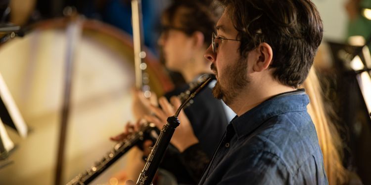 Male student playing the oboe