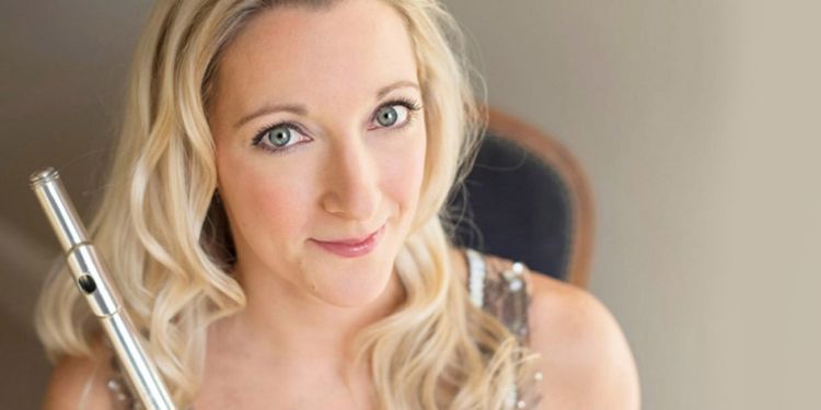 Headshot of Juliette Bausor holding a flute