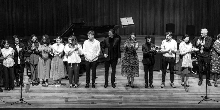 Black and white photo of singers on stage