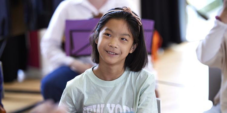 Head and shoulders image of a girl smiling 