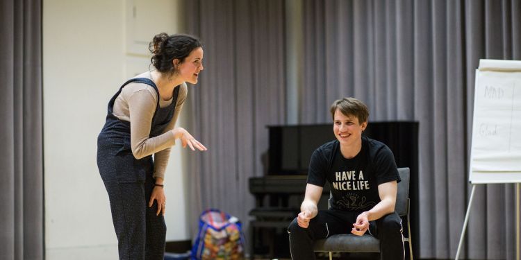 Two participants improvise - one is stood and one is seated