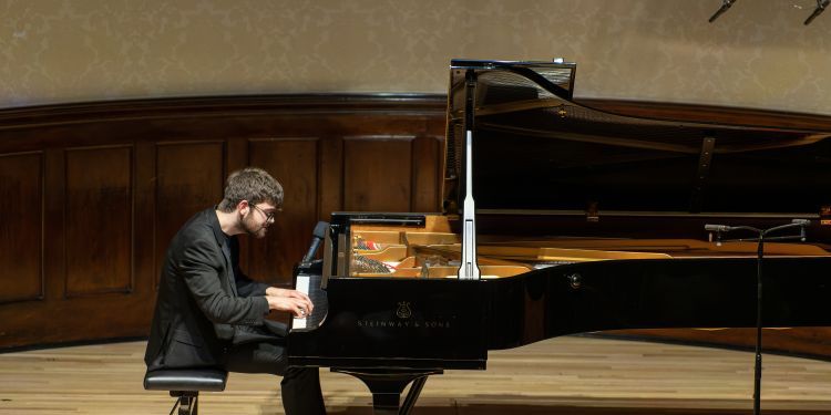 William Bracken playing piano at Wigmore Hall recital