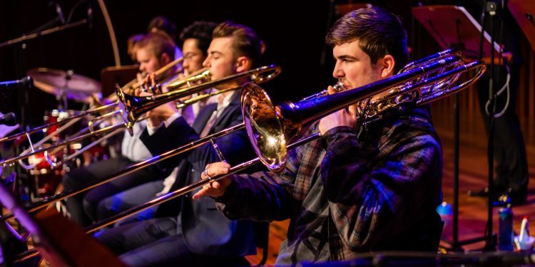 Male student playing trombone