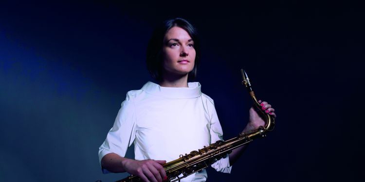 Musician holding a saxophone