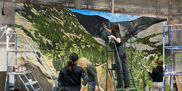 design students painting a backdrop