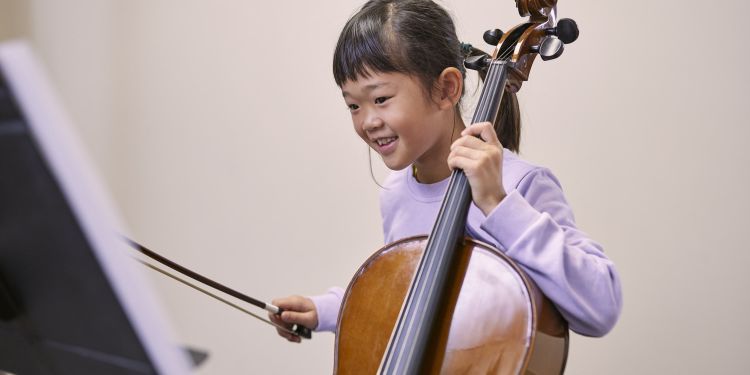 Girl holding a cello
