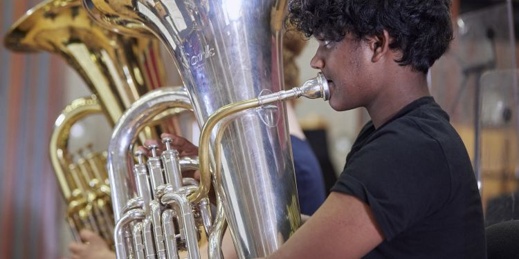 Boy playing tuba